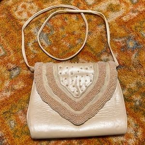 Fashion influences pearl and leather shoulder purse